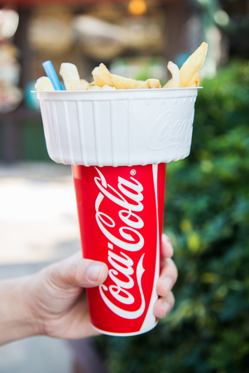 A fry holder atop a cup of soda. Ingenious.